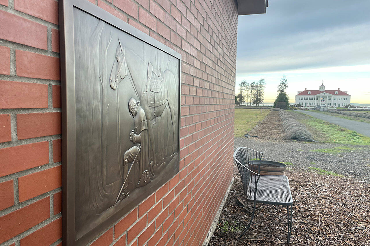 Sequim Gazette photo by Matthew Nash/ A new bronze plaque recreates Arnold Friberg’s “The Prayer at Valley Forge” outside George Washington Inn. Co-owner Dan Abbott said he commissioned it from Minnesota artist Ross Pollard.