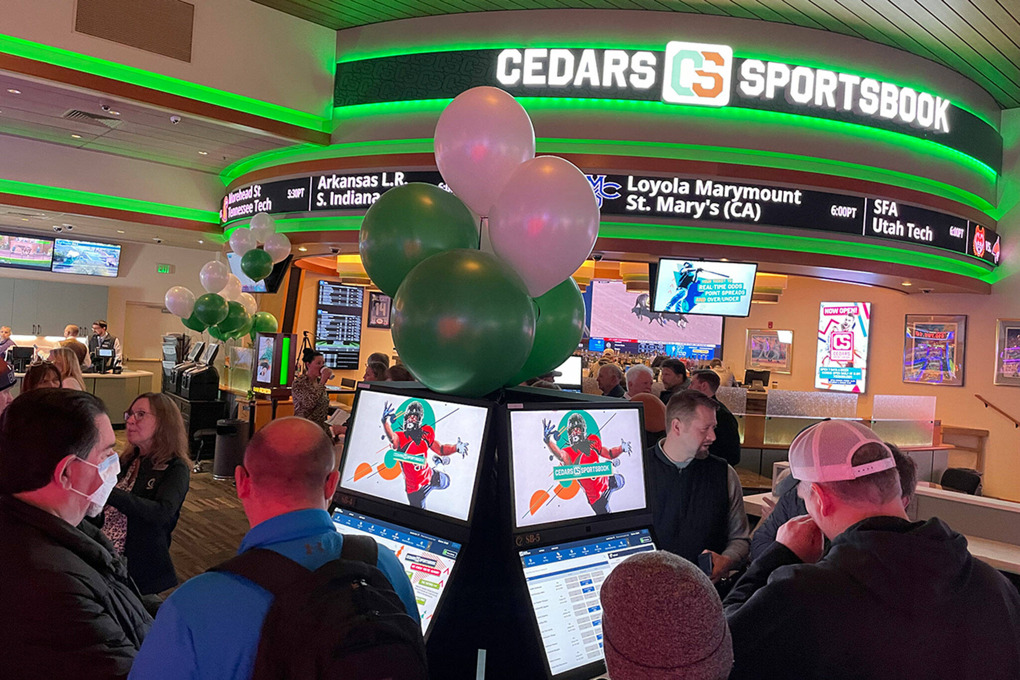 Sequim Gazette photo by Matthew Nash/ Cedars Sportsbook inside 7 Cedars Casino offers eight kiosks and two writing desks for betting on sporting events. Amenities also include large video screens, theater seating, and a scrolling marquee of schedules and scores.
