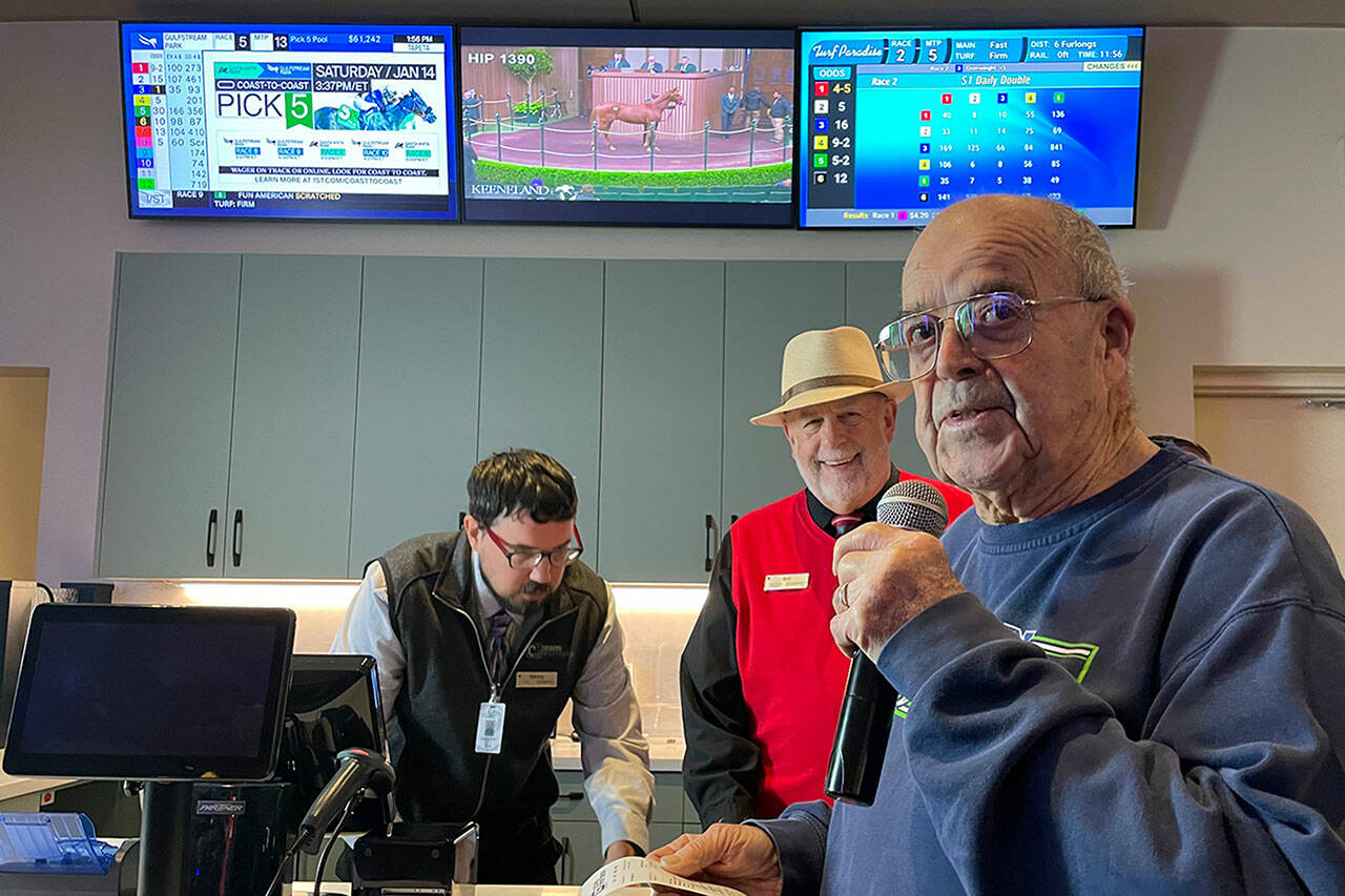 Sequim Gazette photo by Matthew Nash
Howard “Scooter” Chapman, 88, made the first legal bet in Clallam County on Thursday, Jan. 12 at the Cedars Sportsbook inside 7 Cedars Casino at 270756 U.S. Highway 101 in Blyn with help from manager Bill Matsko and staffer Danny Duszynski. Chapman bet $20 on the Seattle Seahawks but they lost 41-23 against the San Francisco 49ers.