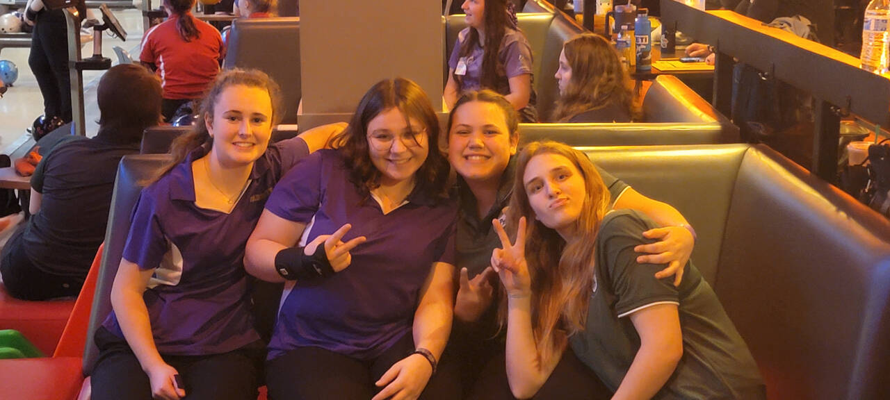 Photo courtesy of Randy Perry / From left, Sequim’s Nikoline Updike and Morgan Kayser join Port Angeles’ Abby Robinson and Paige Pangaro at the state 1A/2A bowling finals in Tukwila this past weekend.