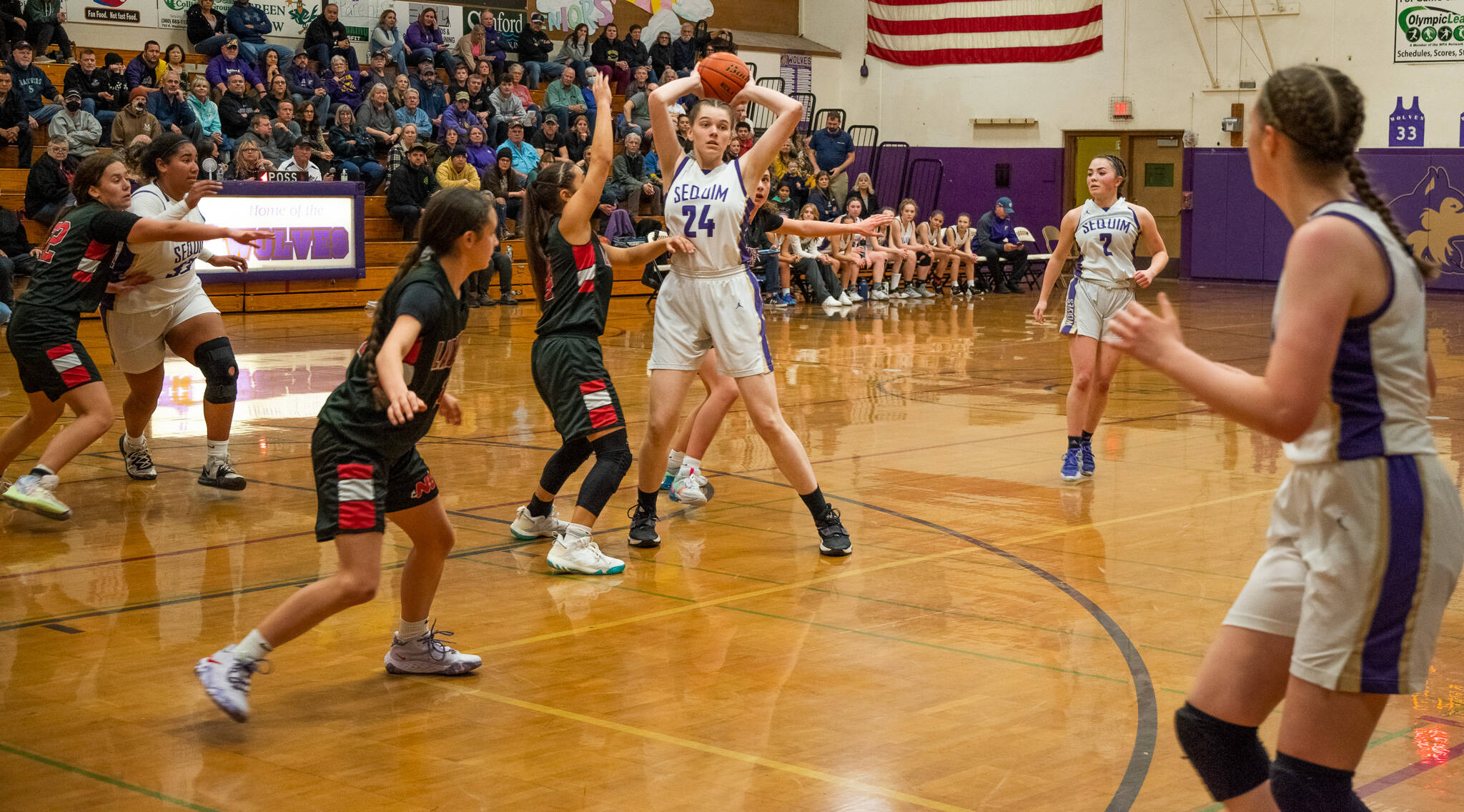 Sequim Gazette photo by Emily Matthiessen / Sequim’s Dani Herman, center, looks for an open teammate in a Feb. 7 non-league match-up with Neah Bay in Sequim.