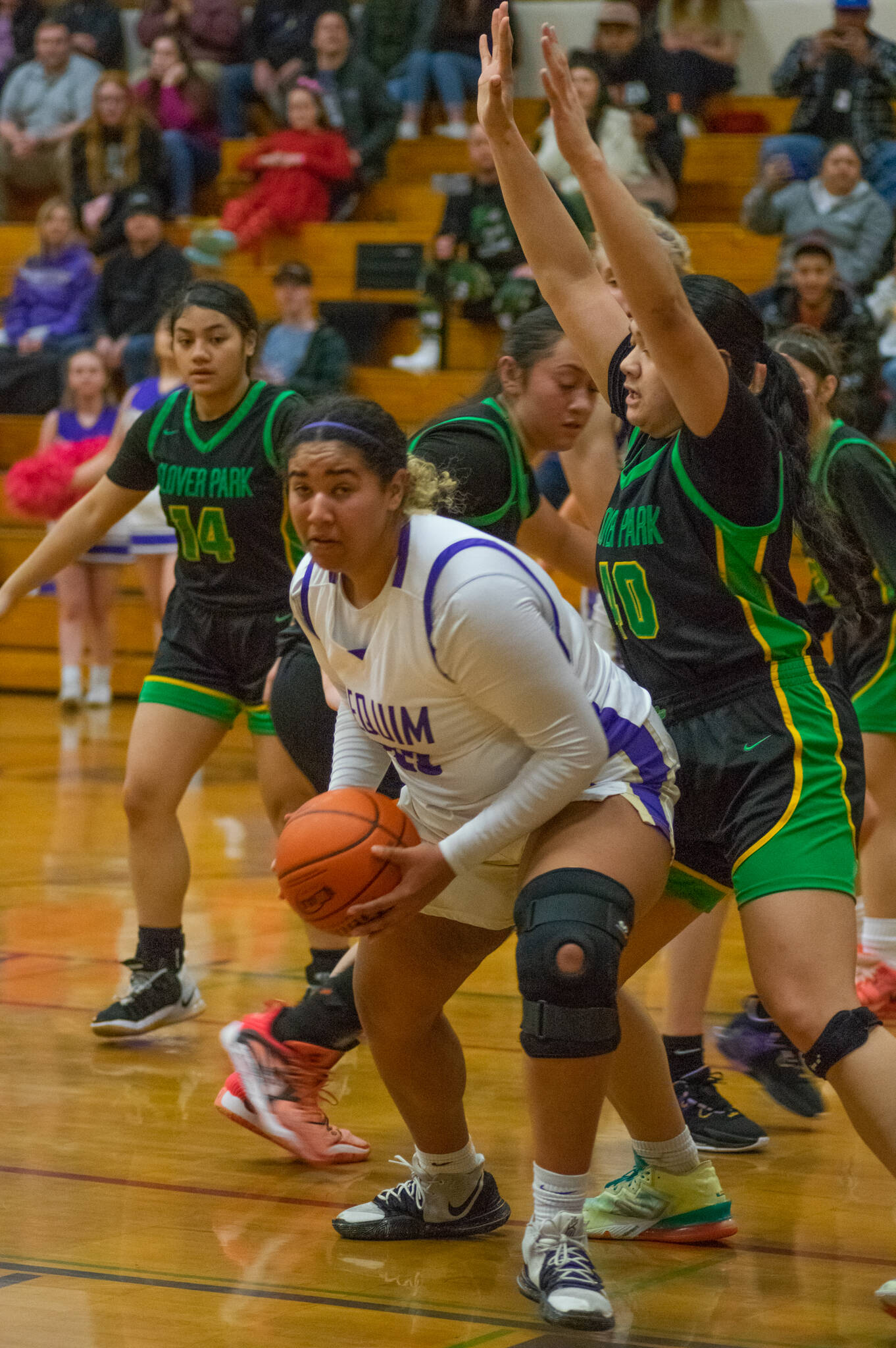 Sequim post Jelissa Julmist looks to score as Clover Park’s Alicia-Ellalynn Soliai defends the basket in Sequim’s 65-29 district tourney win on Feb. 14. Julmist had 13 points, five rebounds and four steals in the victory.