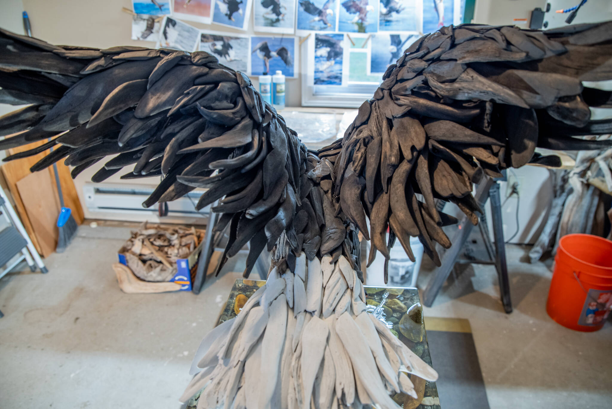 Sequim Gazette photo by Emily Matthiessen
Dozens of driftwood pieces make up the “Fisher King” eagle’s feathers. Molly Omann says that driftwood sculptures are a lot like a giant puzzle.