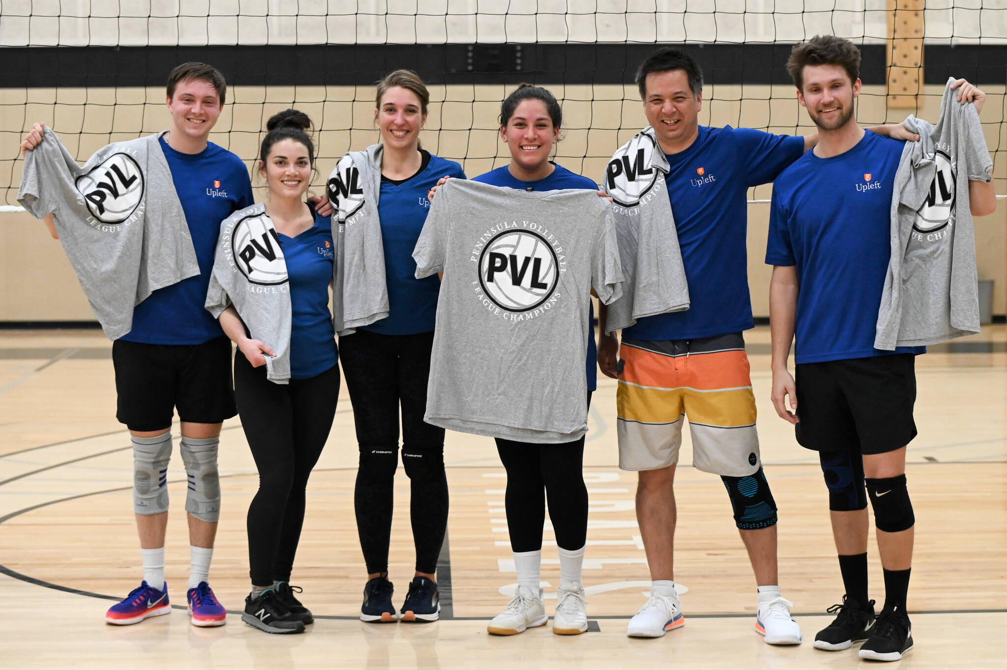 Submitted photo / Upleft teammates celebrate a Peninsula Volleyball League A Division championship in early March. They include, from left, Josh Miller, Jaclyn Duenas, Stina Janssen, Kix McArthur, Matt Miller and Nick Koller. Not pictured is Mindy King.
