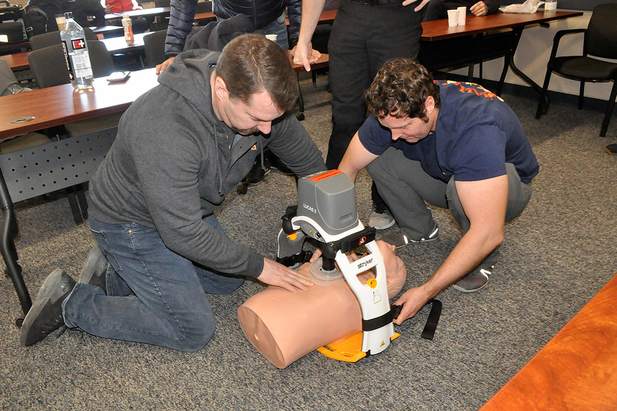 Sequim Gazette photo by Matthew Nash
Capt. Neil Borggard and firefighter/paramedic John Riley use the Lucas 3 chest compression device after a training day on March 2. Capt. Kolby Konopaski said Clallam County Fire District 3 is considering purchasing the device in the future to update their autopulse devices and save space on vehicles.