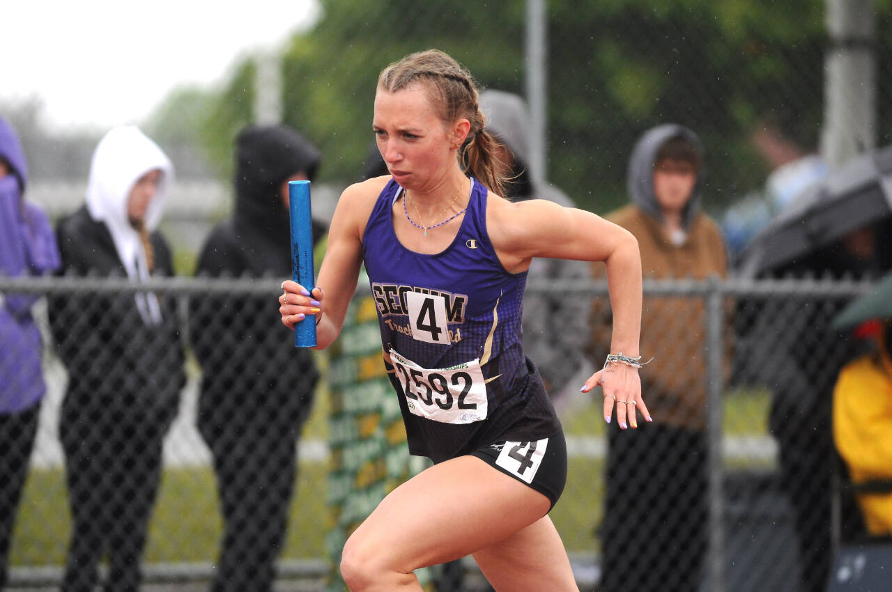 Sequim Gazette file photo by Michael Dashiell / Sequim High junior Hi’ilei Robinson opens the Wolves’ 4x400 relay at the class 2A state meet in 2022. Robinson and teammates Kaitlyn Bloomenrader, Eve Mavy and Riley Pyeatt went on to win the event and win a national title a few weeks later.