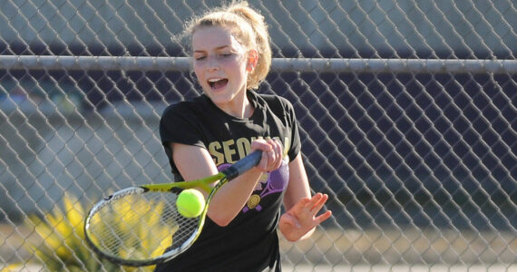 Sequim Gazette file photo by Michael Dashiell
Sequim’s Kendall Hastings hits a forehand in a match against North Mason’s Rachell Youngman in March 2022.