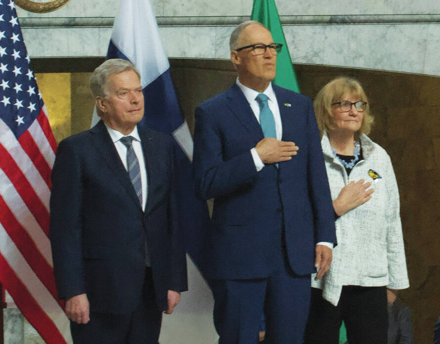 Photo by Renee Diaz/WNPA News Service / Sauli Niinistö, the President of the Republic of Finland and Gov. Jay Inslee and wife Trudi listen as both national anthems are played inside the state capitol earlier this week. Niinistö, began his five-day U.S. tour in Washington state, attended a joint session of the Legislature and met with Gov. Jay Inslee on March 6.