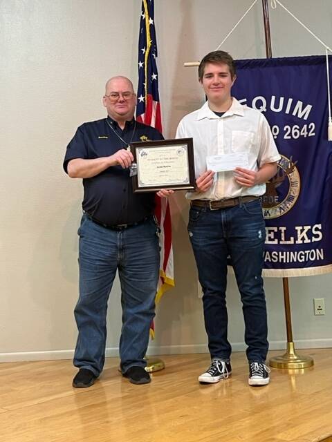 Submitted photo / Sequim High sophomore Luke Rocha accepts his Sequim Elks Lodge Student of the Month honor for February 2023 from lodge secretary Jim Headley.