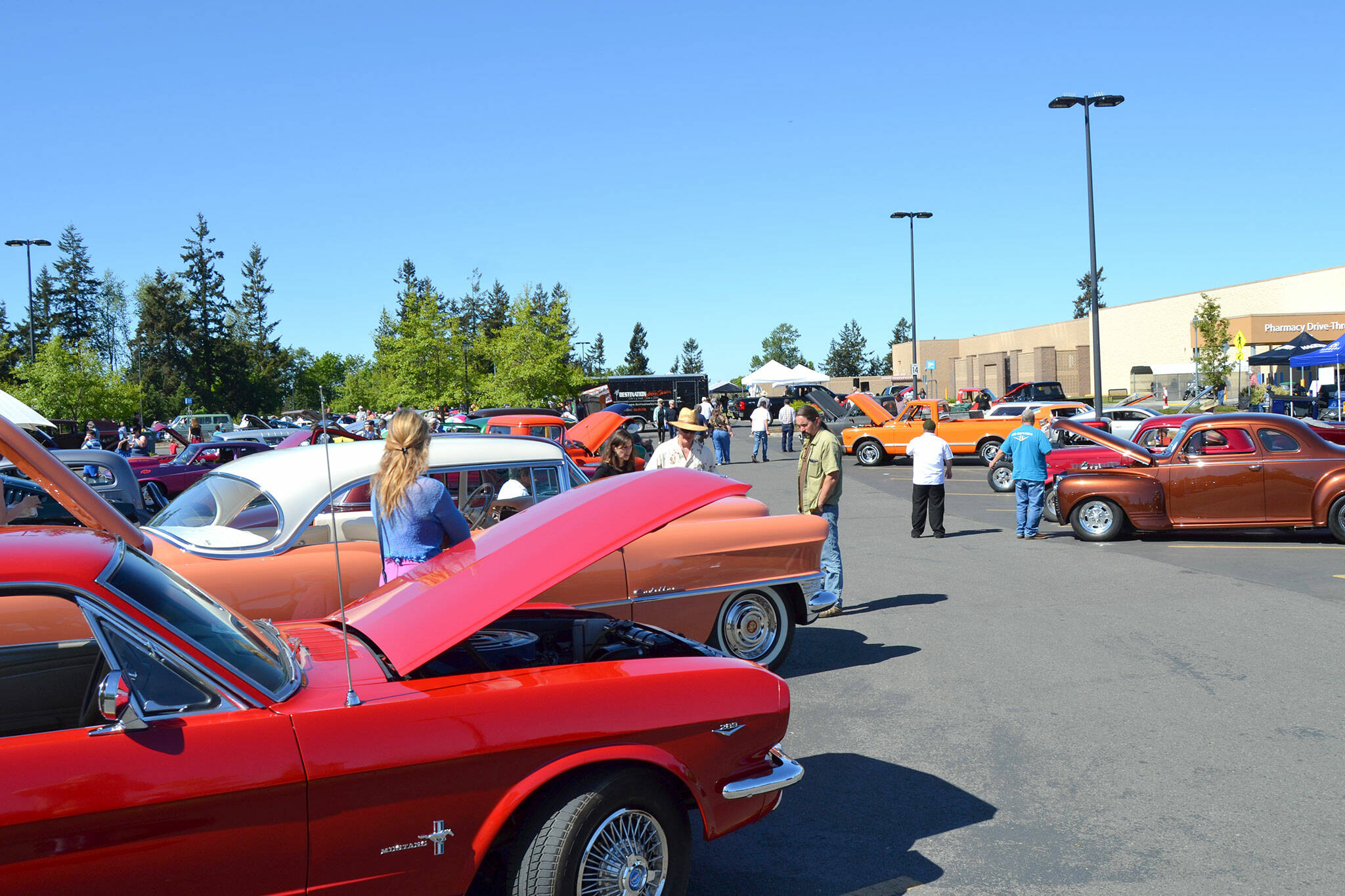 Sequim Gazette file photo by Matthew Nash / Attendees enjoy the Sequim Irrigation Festival Car Cruzz and Show in 2018. The Classic Cruise Show is back this May, with a new location for the show and judging.