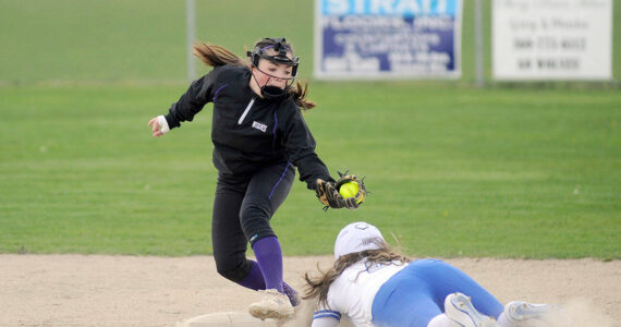 Michael Dashiell/Olympic Peninsula News Group
Sequim shortstop Hannah Bates, left, puts the tag on an Olympic runner in an April 13 league match-up in Sequim.
