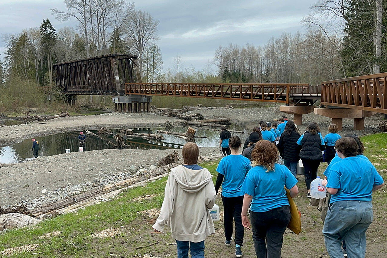 Photo courtesy of ​​Ann Flack/ Sequim Sunrise Rotary
Sequim Interact Club members walk from Sequim Middle School to the Dungeness River for their annual Walk for Water fundraiser. Students carried water about two miles back to the school to raise awareness for those in other countries who walk numerous hours daily to gather water. They also seek funds to build a well in Ghana.