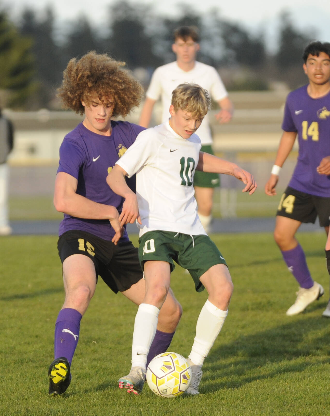 Sequim Gazette photo by Michael Dashiell / Sequim’s Sam Stewart, left, and Port Angeles’ Matthew Miller vie for the ball in an April 18 Olympic League game.