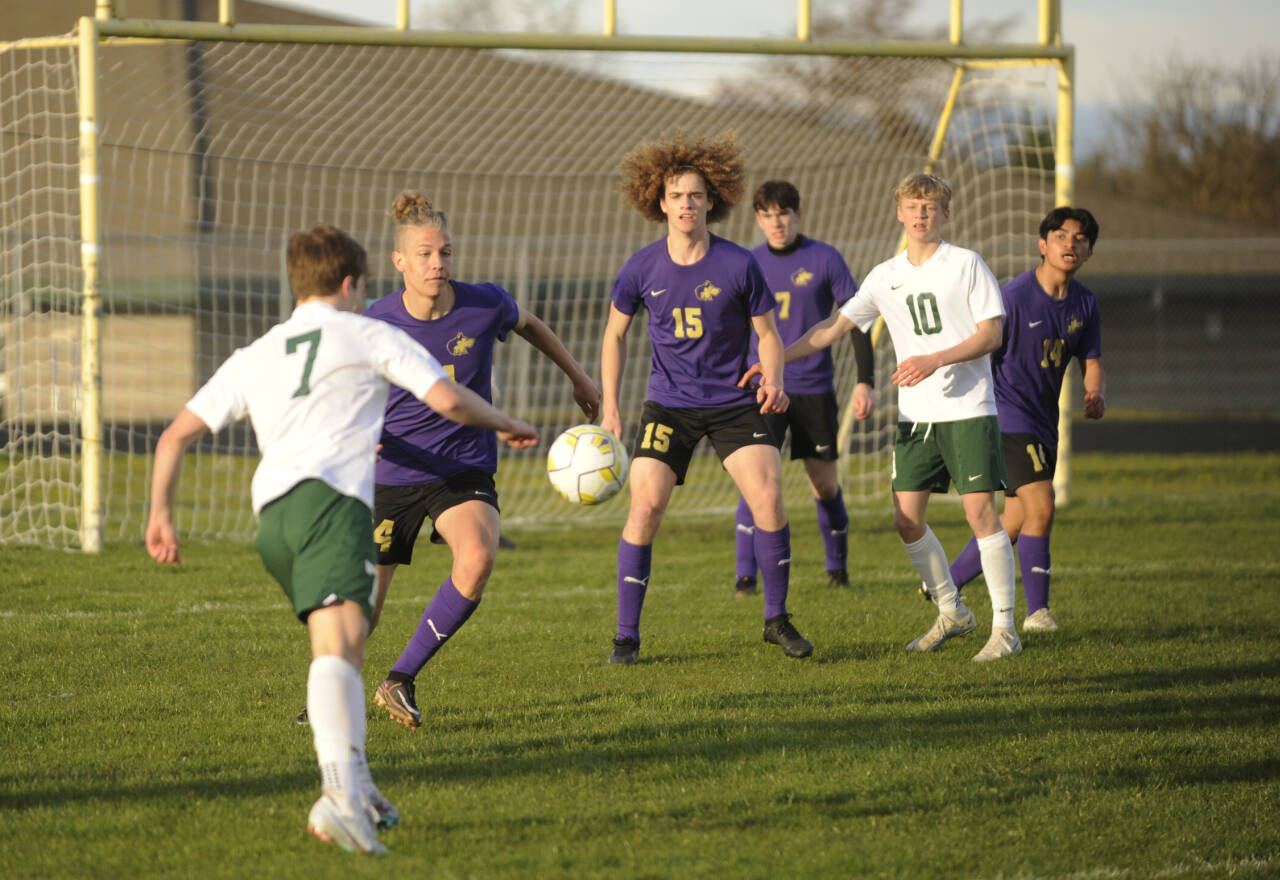 Sequim Gazette photo by Michael Dashiell / Port Angeles’ Kaleb Gagnon, left, looks to put a shot on goal in an April 18 game in Sequim, as Wolves (from left) Jack Henninger (24), Sam Stewart (15), Colin Feik (7) and Evan Cisneros (14) defend the play.