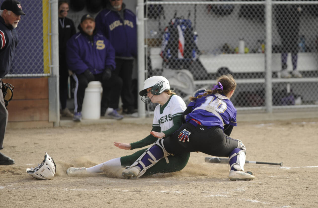 Sequim Gazette photo by Michael Dashiell / Sequim catcher Mikki Green tags Port Angeles’ Alexandria Money at the plate for a key out in the Wolves’ 7-6 win over Port Angeles on April 18. Sequim recorded two outs at the plate in the fifth inning to stymie Roughrider rallies.
