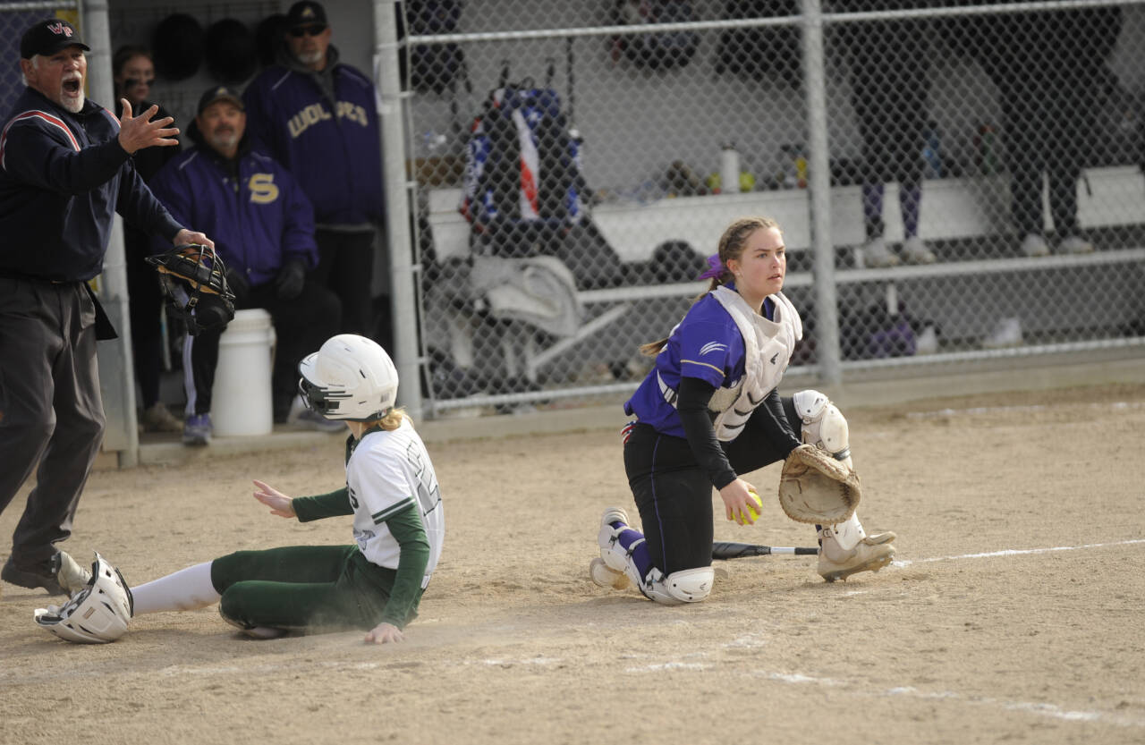 Sequim Gazette photo by Michael Dashiell
Sequim catcher Mikki Green, right, tags Port Angeles’ Alexandria Money at the plate for a key out in the Wolves’ 7-6 win over Port Angeles on April 18. Sequim recorded two outs at the plate in the fifth inning to stymie Roughrider rallies.