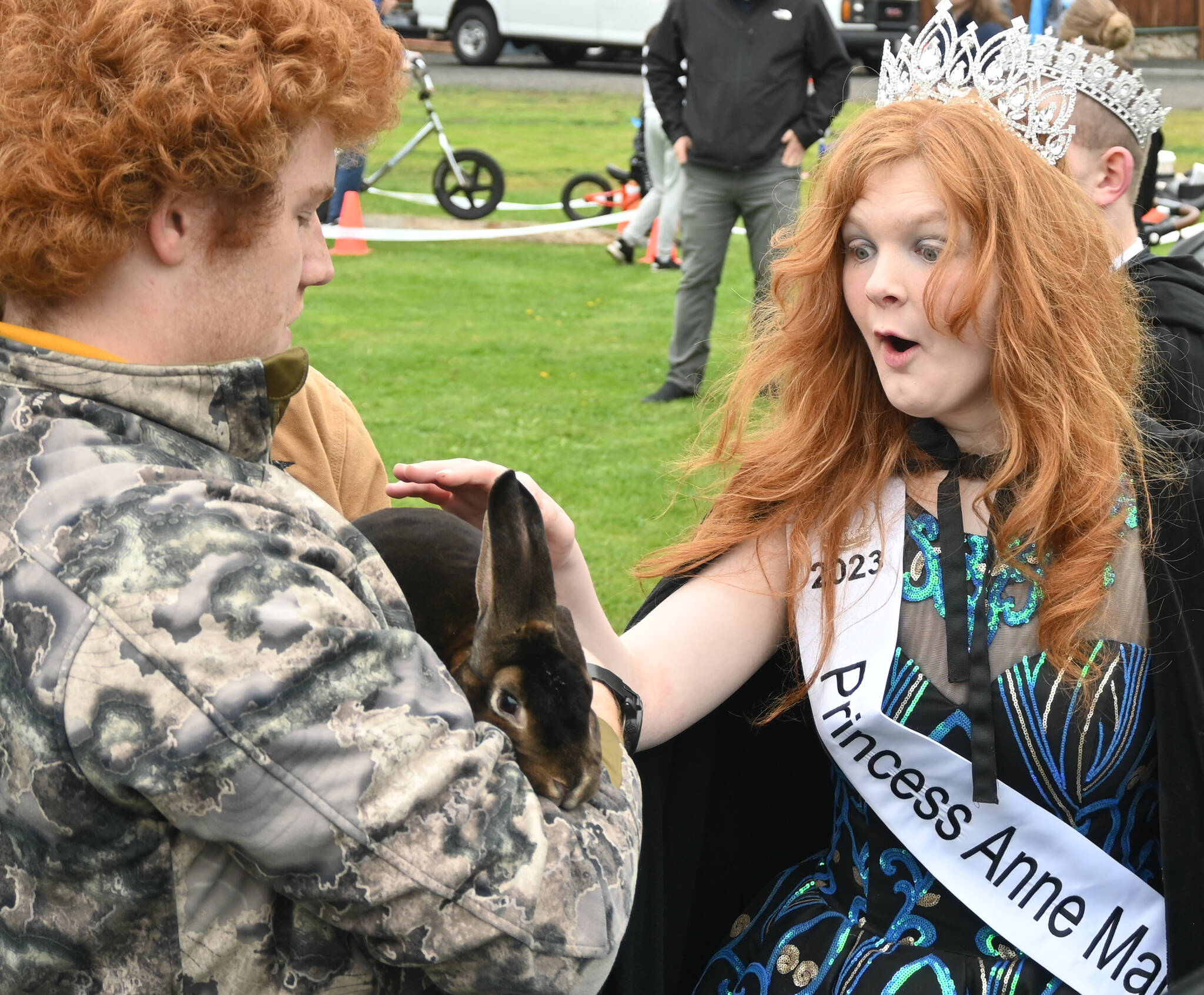 Sequim Gazette photo by Michael Dashiell
Princess Anne Marie Barni pets a rabbit held by Sequim High FFA member Jobe Kirner at the Family Fun Day on May 6.