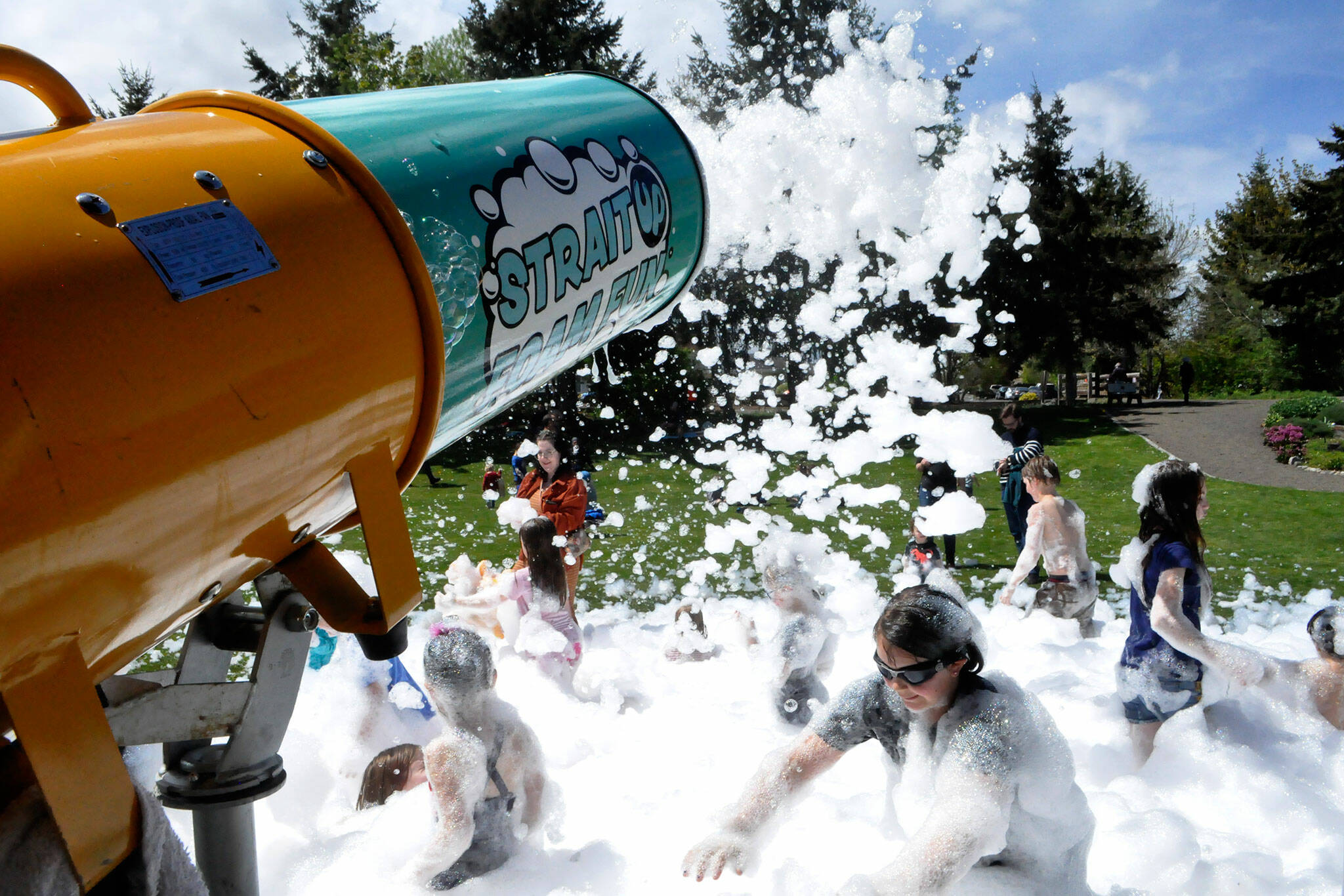 Sequim Gazette photo by Matthew Nash/ As part of Family Fun Days, Strait Up Foam Fun came to Carrie Blake Community Park on Sunday offering children and adults the chance to play in the eco-friendly, biodegradable foam for hours.