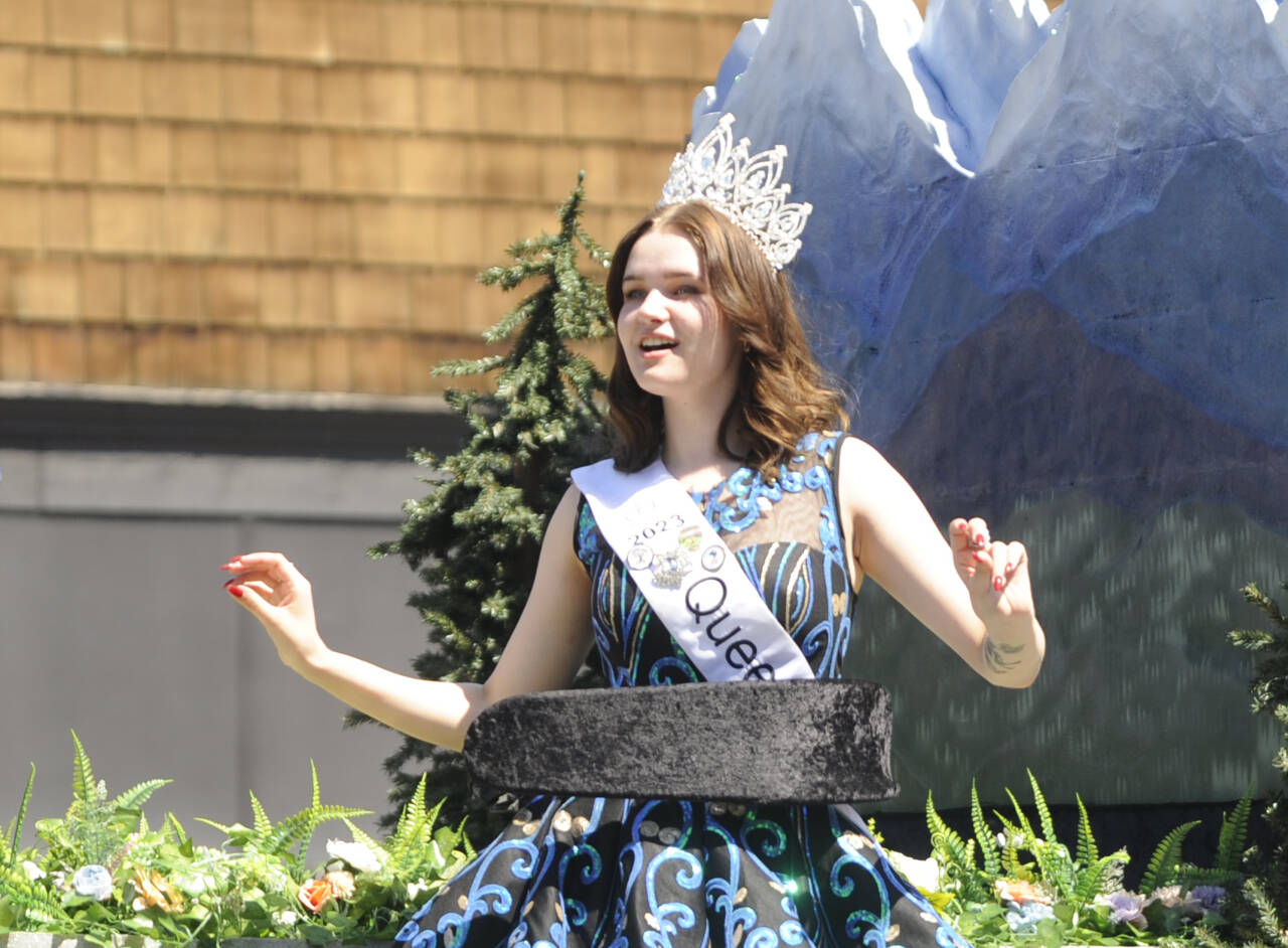 Sequim Gazette photo by Michael Dashiell / Sequim Irrigation Festival queen Pepper Reymond enjoys some tunes as she and festival royalty say hello to the Grand Parade crowd on Saturday, May 13.