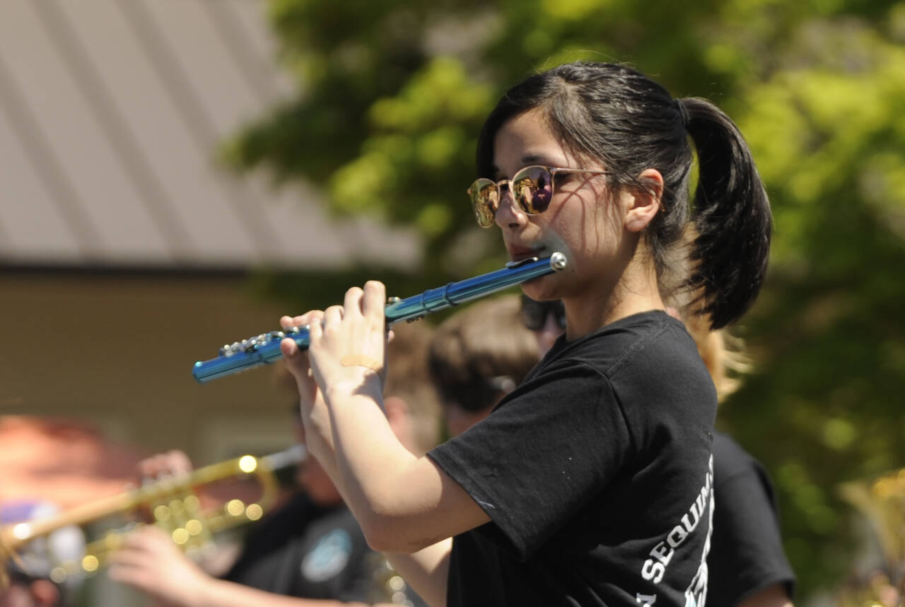 Sequim Gazette photo by Michael Dashiell / Sequim High School and Sequim Middle School band members entertain the crowd at the Sequim Irrigation Festival Grand Parade on Saturday, May 13.