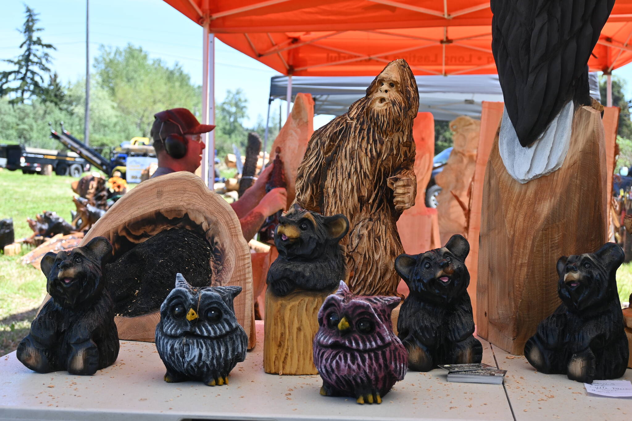 Sequim Gazette photo by Michael Dashiell / Some creations by Nick Bielby of Nicklby Wood Carving and Eric Berson of The Dreamer’s Woods, both of Port Angeles, are on display at their booth at the Sequim Irrigation Festival Logging Show on May 12.