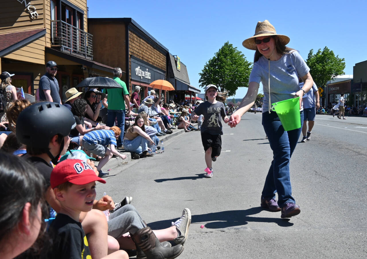 Sequim Gazette photo by Michael Dashiell
Sequim Library branch manager Emily Sly and other library system staff hand out candy during the Sequim Irrigation Festival Grand Parade on May 13.