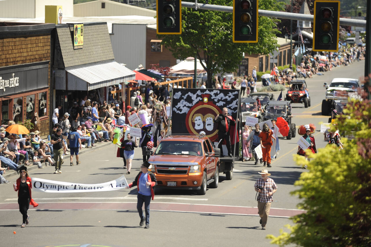 Sequim Gazette photo by Michael Dashiell
Decked out in various costumes, thespians and crews from Olympic Theatre Arts productions greet attendees of the Sequim Irrigation Festival Grand Parade on May 13.