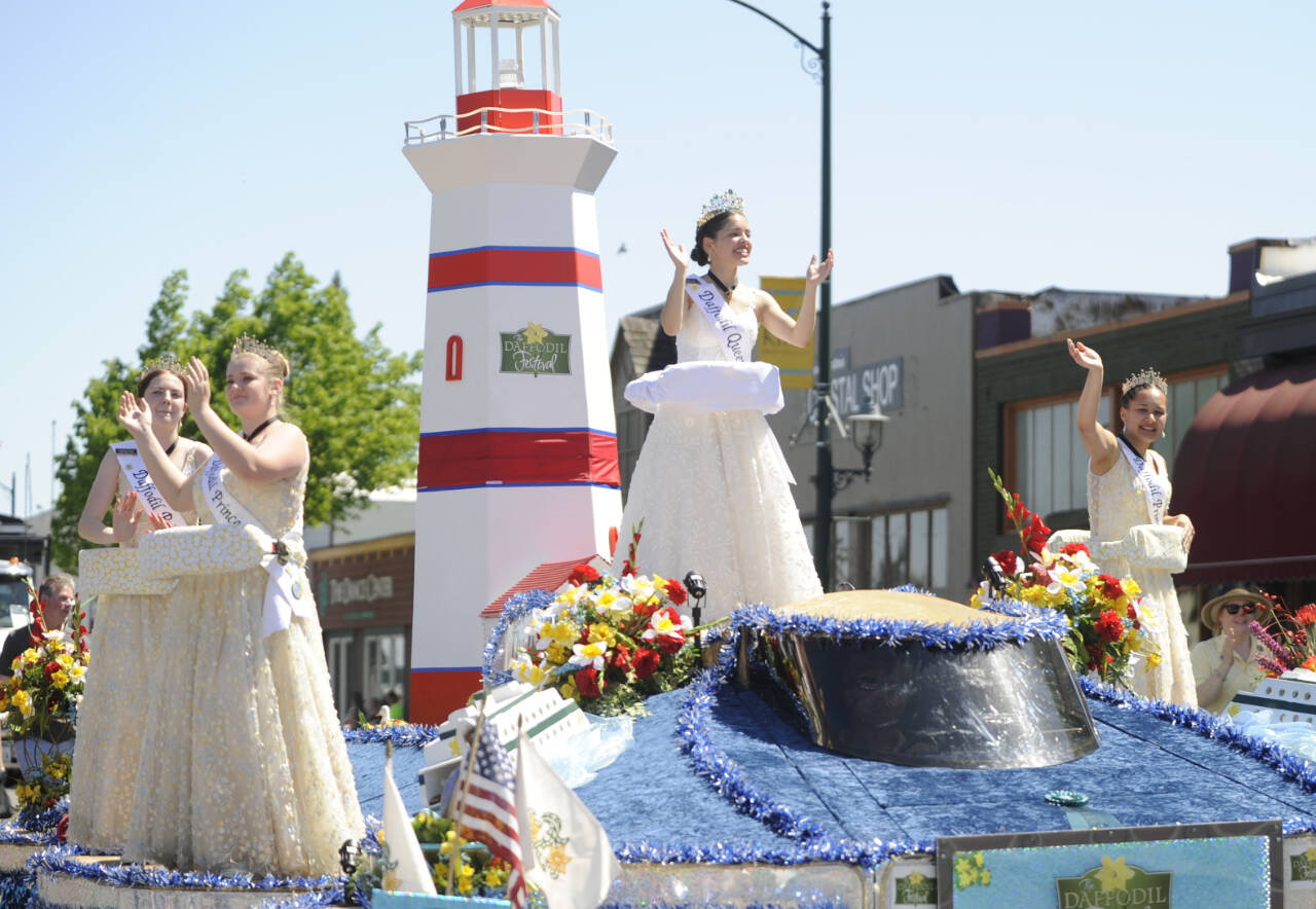 Sequim Gazette file photo by Michael Dashiell / Royalty from the Tacoma Daffodil Festival wave to the Sequim Irrigation Festival Grand Parade crowd on May 13. The entry took home the Grand Sweepstakes award.