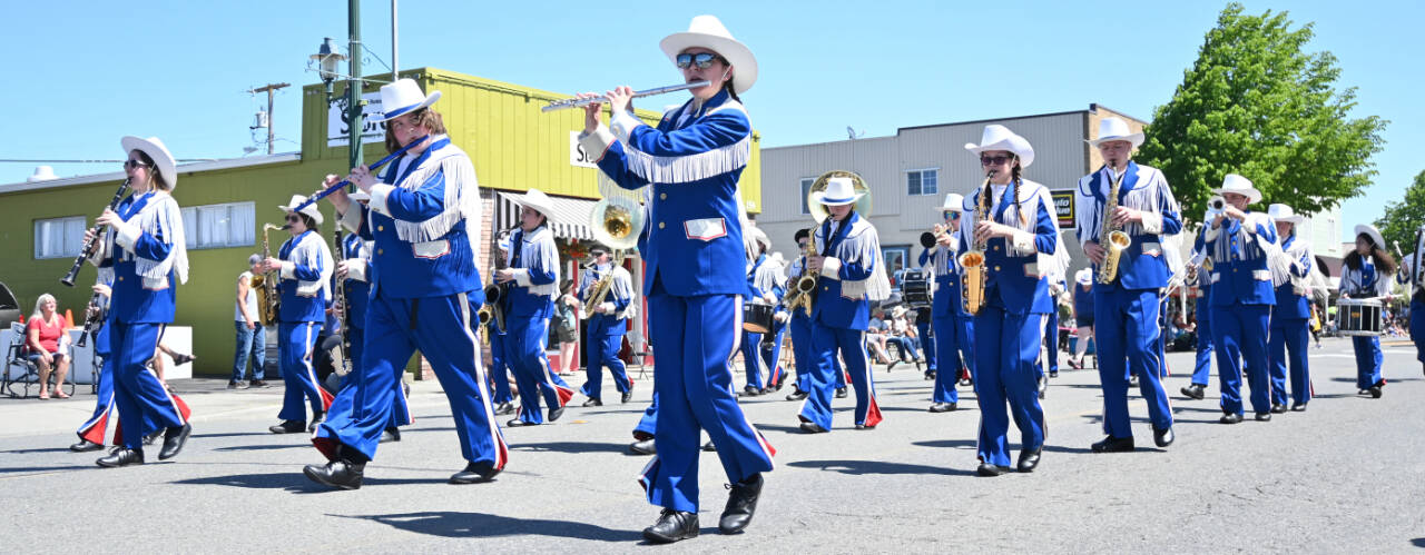 Sequim Gazette file photo by Michael Dashiell / Members of the Chimacum High School Band entertain the crowd at the Sequim Irrigation Festival Grand Parade on May 13. The group took second place in the high school band division.