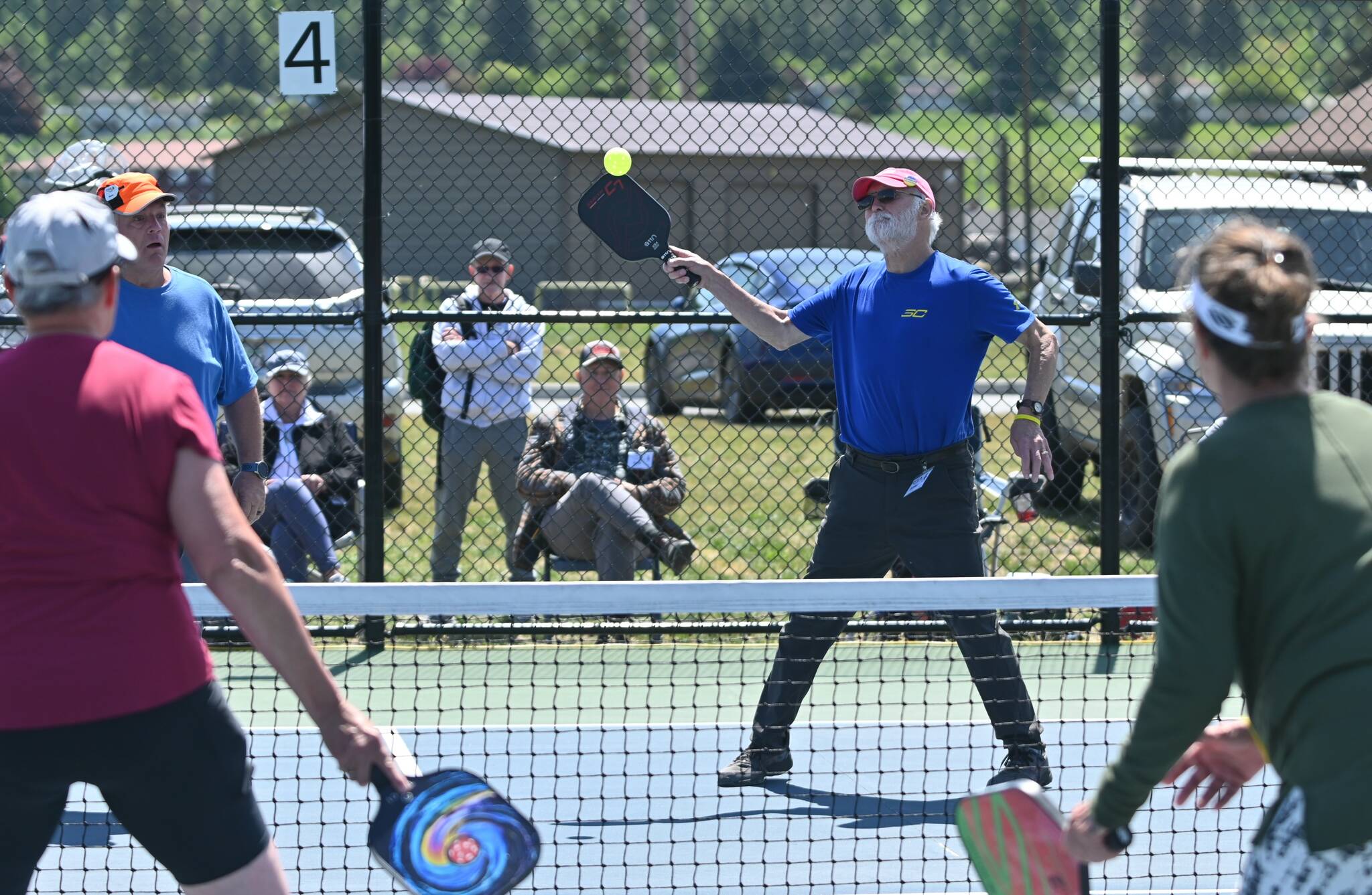 Sequim Gazette photo by Michael Dashiell / Mike Richer, right, and Kevin Jenks take on Sherri Gyovai and Cindi Pettit in the championship match at the Big Dill Fun Day tournament at Carrie Blake Community Park on May 20.
