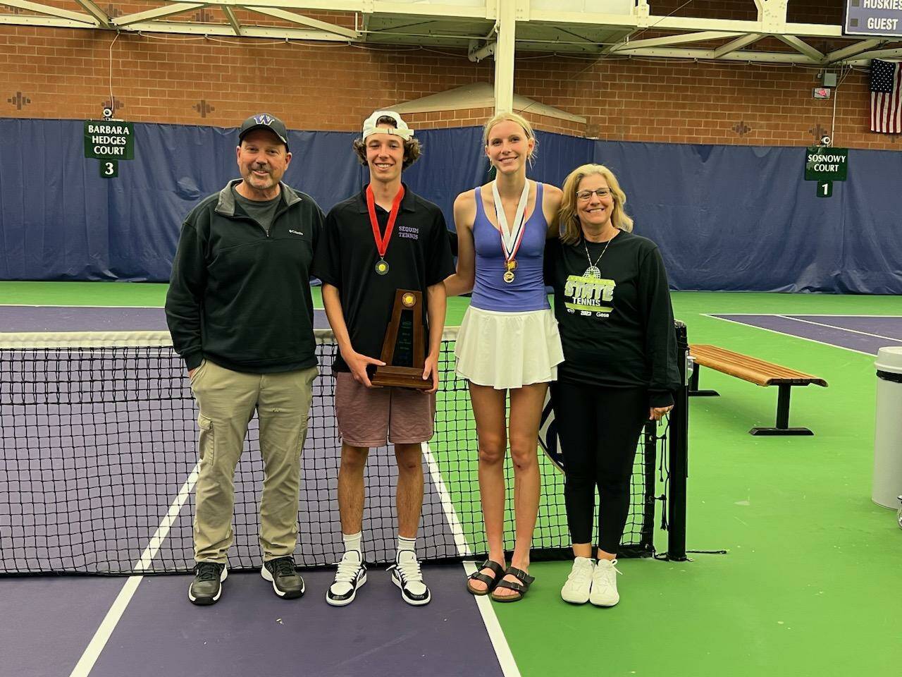 Photo courtesy of Mark Textor / At center, Sequim High’s Garrett Little and Kendall Hastings celebrate strong finishes at the class 2A state tennis tournament in Seattle on May 26. Little took second and Hastings placed third. Celebrating with them are head coach Mark Textor and assistant coach Andrea Dietzman.