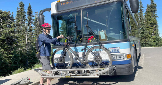 File photo by Paula Hunt/Olympic Peninsula News Group / Nils Andermo of Port Angeles takes Clallam Transit’s Hurricane Ridge shuttle to the summit in 2022. Scheduled to start this week, shuttle service to the ridge has been delayed after the lodge at the summit was destroyed by a fire, National Park Service officials said.