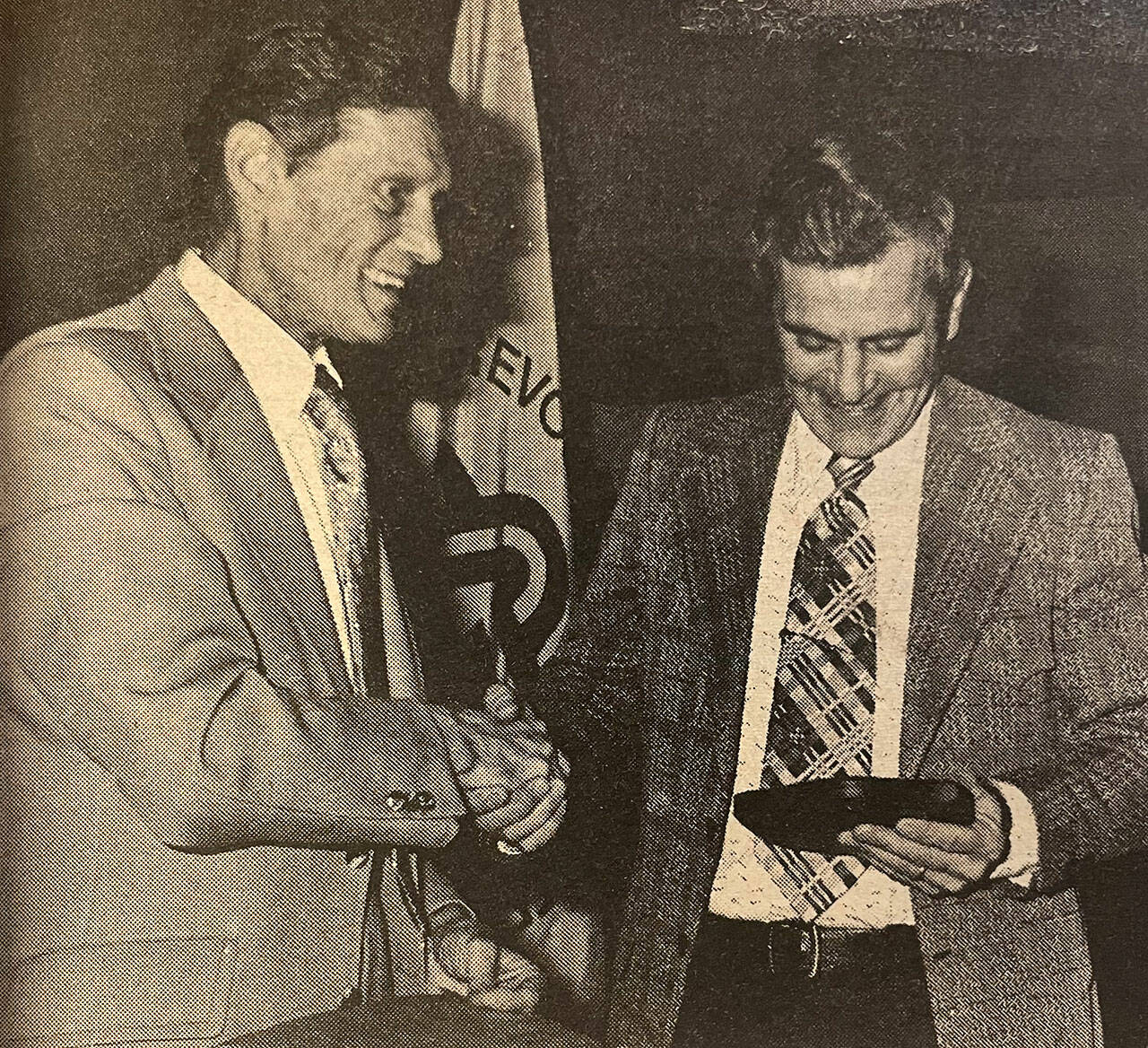 Sequim Gazette file photo/ Jerry Angiuli, right, was awarded Sequim Citizen of the Year in 1975 for his work with youth sports. He helped coach football, baseball, competitive shooting at various points in his life.