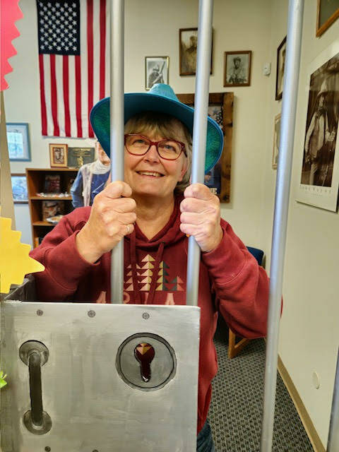Photo courtesy of KSQM 91.5 FM / Mariner Café owner Marie Dickinson is “jailed” in KSQM 91.5 FM’s 2023 Spring Fund Drive.