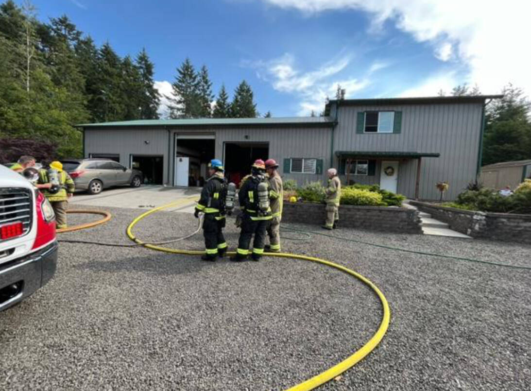 Photo by Chris Turner/Clallam County Fire District 3 / Clallam County Fire District 3 personnel respond to a fire on Happy Valley Road in June 23.