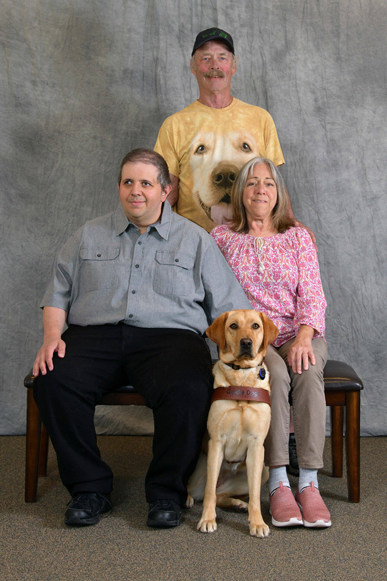 Photo courtesy Sequim Puppy Raisers/ Darrell and Kandi Whitley with the Sequim Puppy Raisers raised Leora as a puppy and the yellow lab graduated the Guide Dogs for the Blind program with Chris from Canada on June 3.
