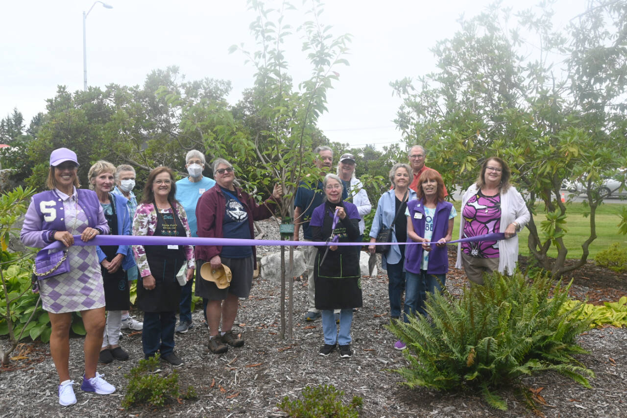 Sequim Gazette photo by Michael Dashiell / Ellen Castleman, Sequim Prairie Garden Club president, and representatives of the Sequim-Dungeness Valley Chamber of Commerce officially open the club’s 75th anniversary event on July 29.