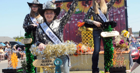 Photo by Keith Thorpe/Olympic Peninsula News Group / Clallam County Fair royalty, from left, Princess Olivia Ostlund, Queen Allison Pettit and Junior Princess Kendall Adolphe ride their festival float, which received the Irrigation Festival Chairmans Award at the Sequim Irrigation Festival in May.