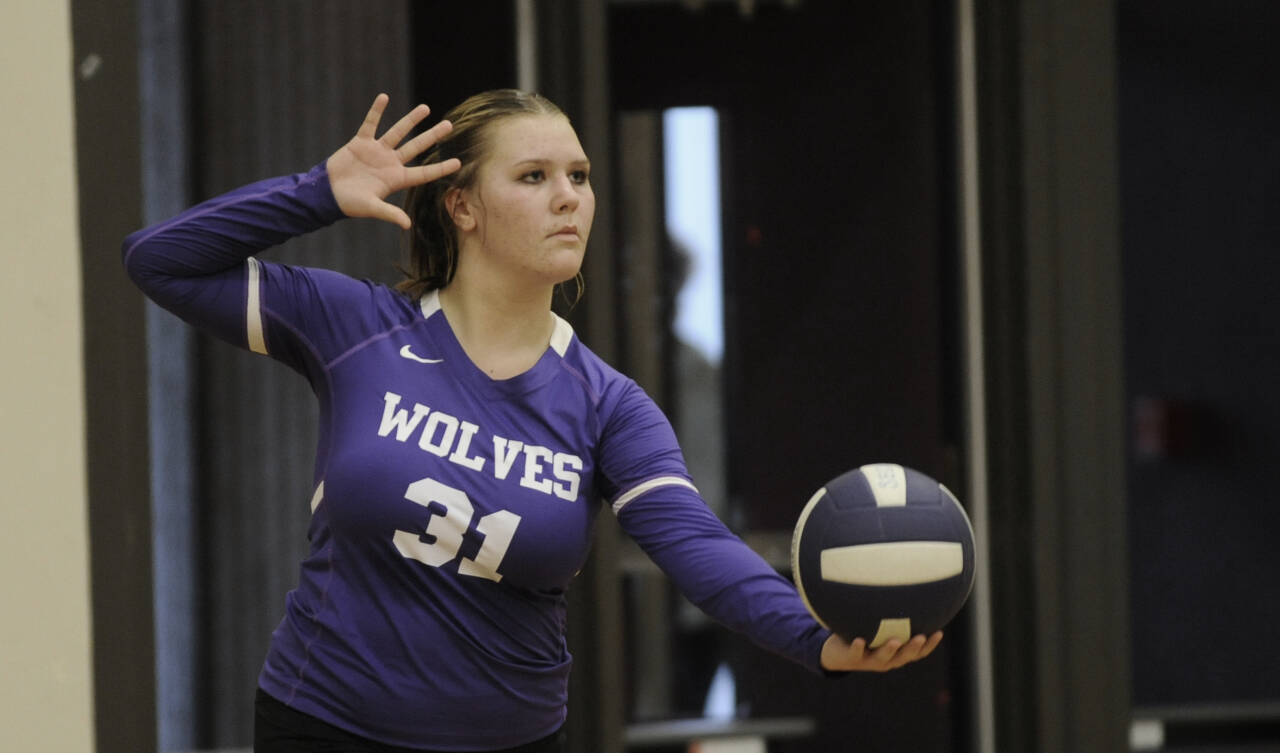 Sequim’s Ashton Reichner looks to help the Wolves close out North Mason in the first set of SHS’s season-opening match on Sept. 12.