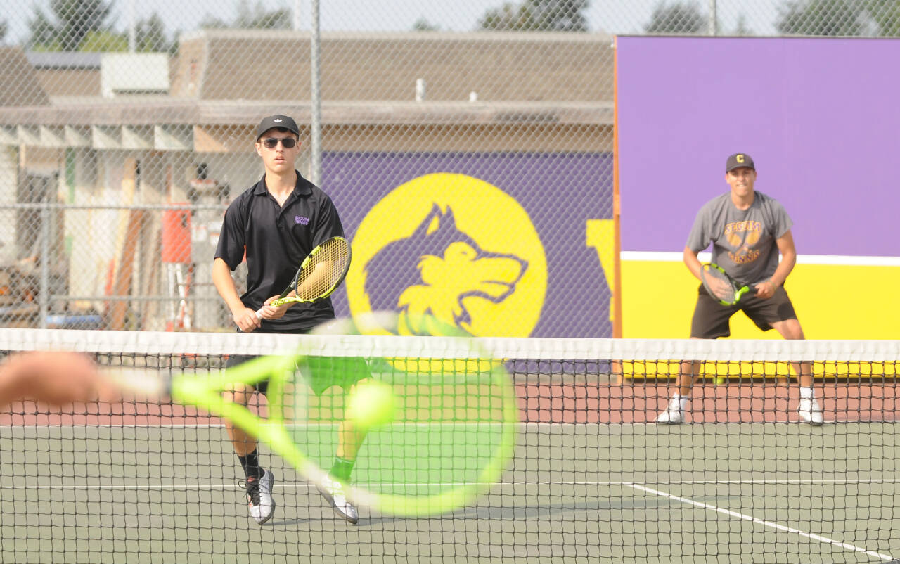 Sequim Gazette file photo by Michael Dashiell / Sequim’s William Hughes, left, and Espn Judd take on North Kitsap’s Mason Chmielewski and Ethan Gillespie in No. 1 doubles play in a 2022. Hughes, a senior, is back for his fourth season with the Wolves.