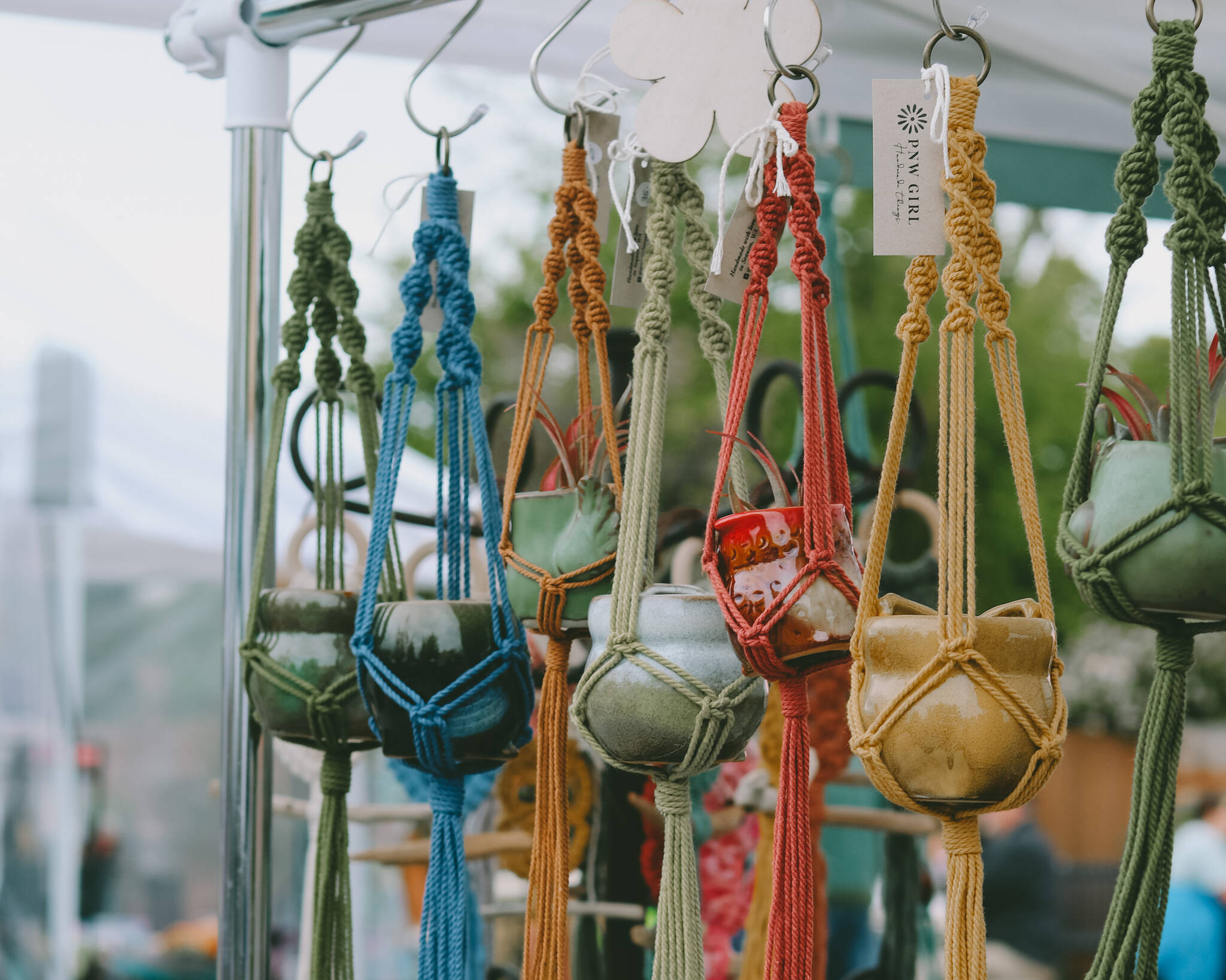 Macrame creations by PNW Girl are one of the many items available each Saturday at the Sequim Farmers and Artisans Market.