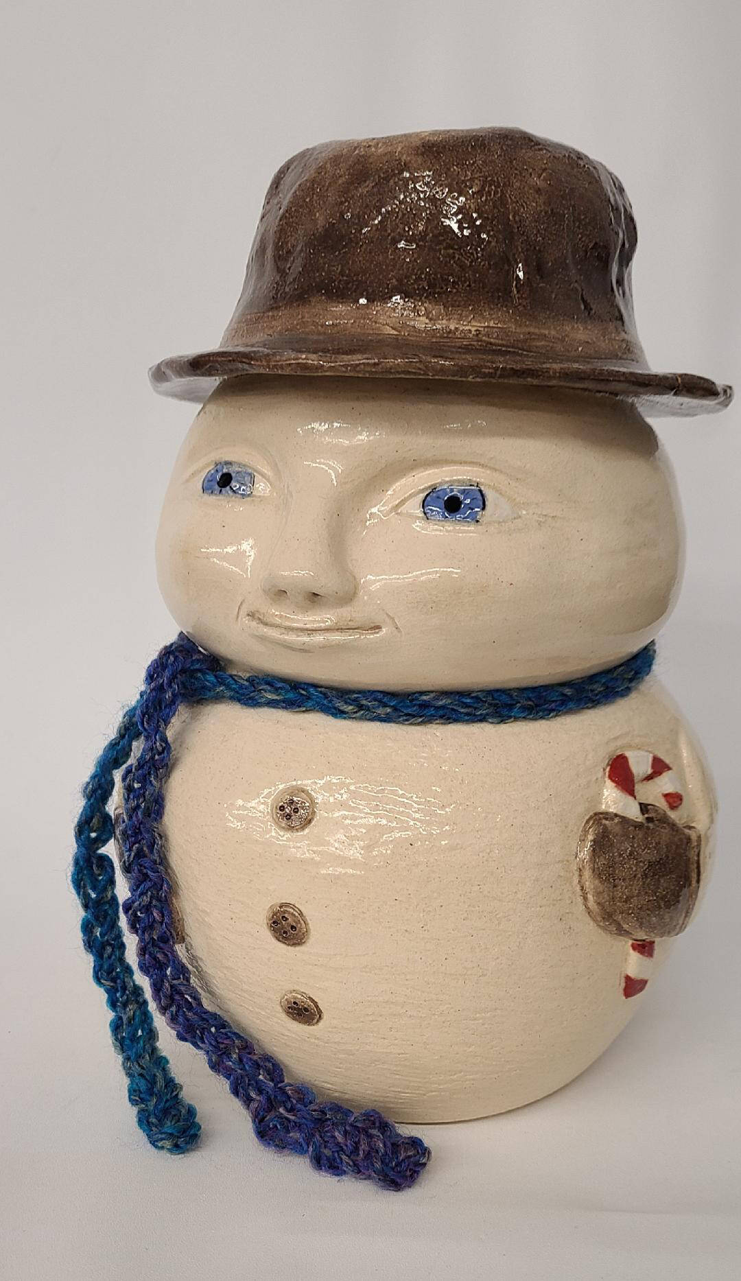 Photo courtesy of Blue Whole Gallery / “Snowman” ceramic by Janet Piccola.