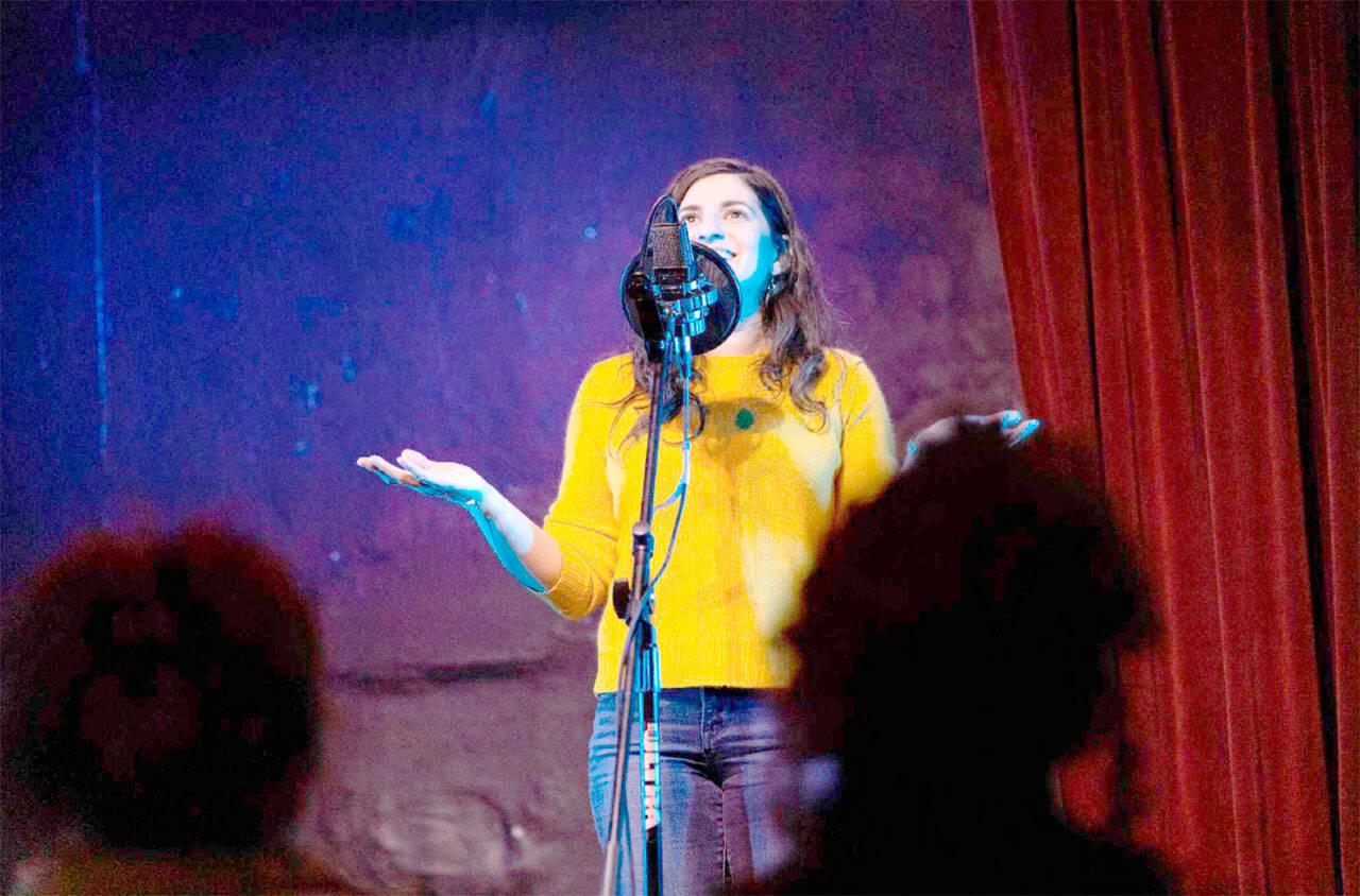 Photo by Elizar Mercado
Nessa Goldman, host of the Out Loud Story Slam, tells a story at The Jewel Box Theatre in Poulsbo. Story Slam returns to Studio Bob in Port Angeles on Sept. 22.