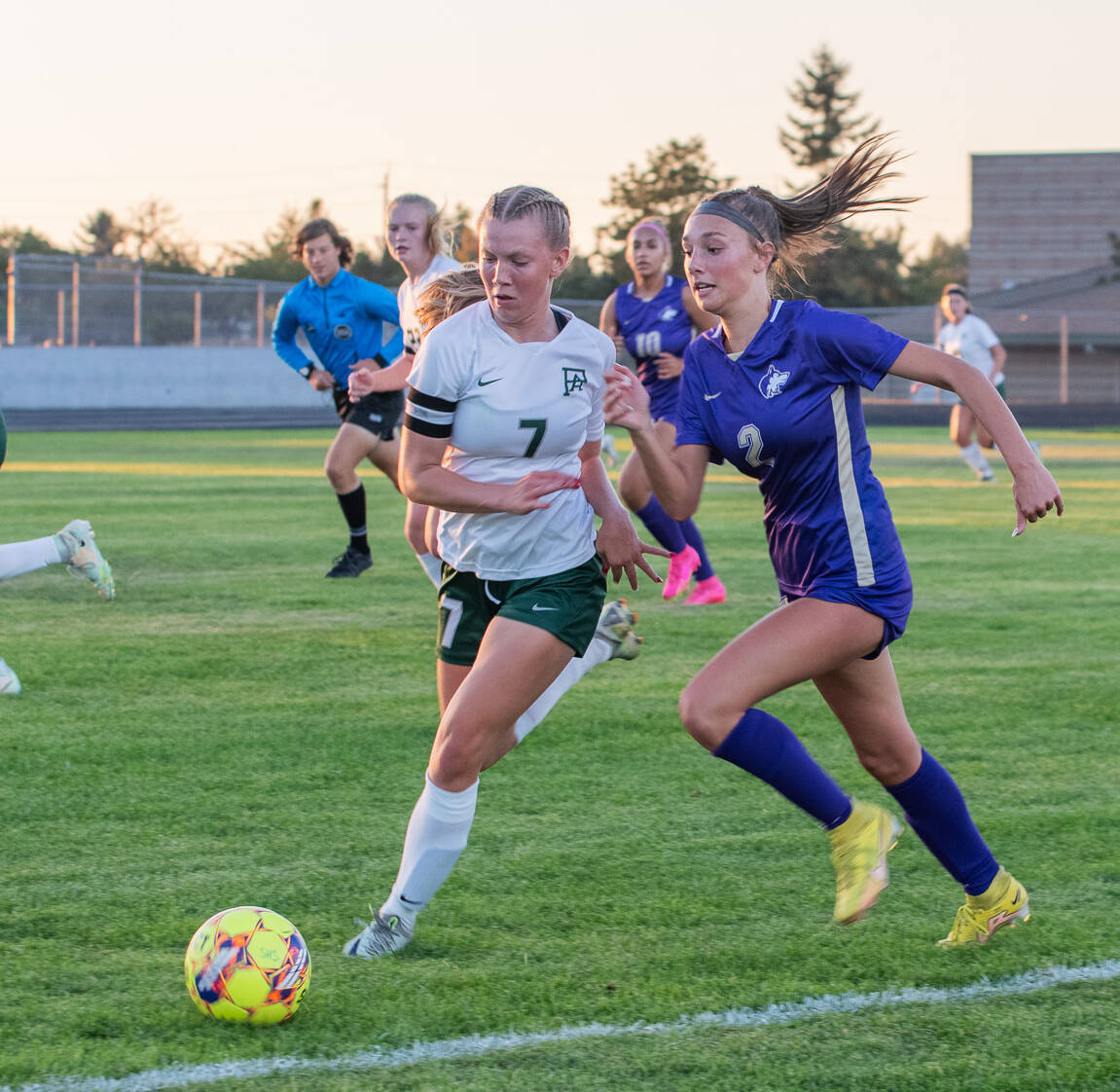 Sequim Gazette photo by Emily Matthiessen / Port Angeles’ Izzy Felton, left, and Sequim’s Mikiah Winter vie for the ball in a Sept. 15 Olympic League game in Sequim. The Wolves defended their home turf with a 2-1 victory.