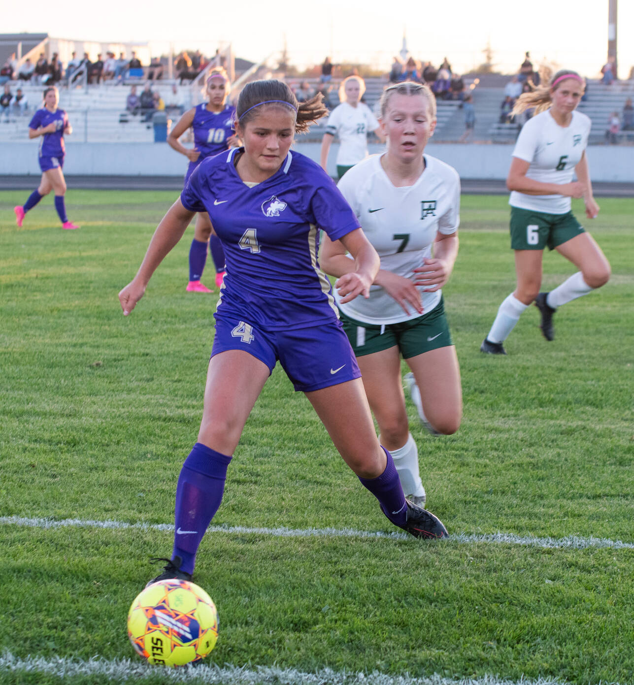 Sequim Gazette photo by Emily Matthiessen
Sequim’s Raimey Brewer, left gains possession as Port Angeles’ Izzy Felton pursues the play in a Sept. 14 Olympic League match-up in Sequim. The host Wolves won, 2-1.