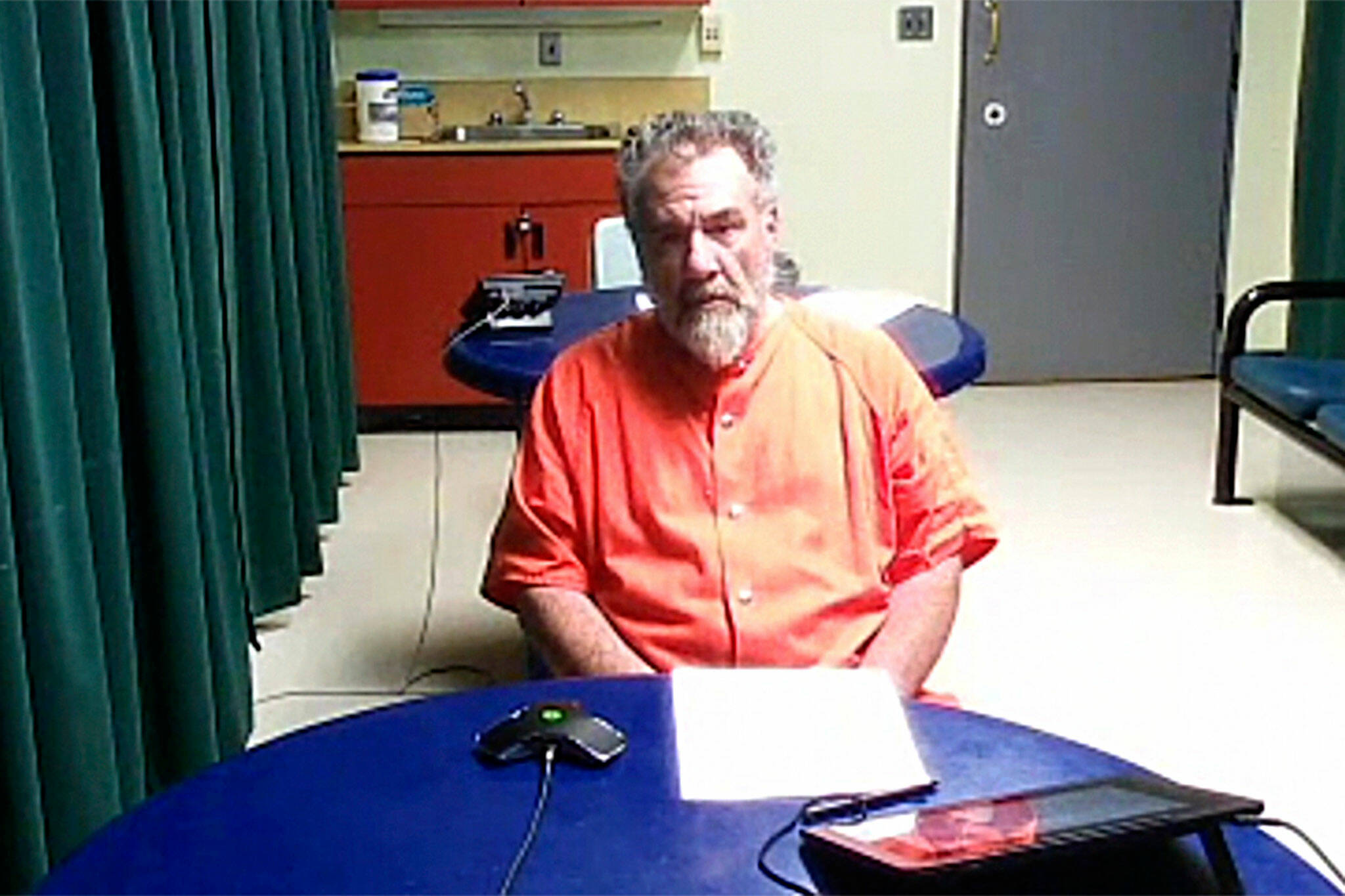 Photo screen capture/ John Fitzgerald Barcellos, 59, of Sequim appears in Clallam County Superior Court on Sept. 20 where he was charged with 10 felonies including three counts of assault in the second degree with a deadly weapon, four counts of harassment with threats to kill, and assault in the third degree of a law enforcement officer.