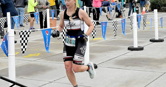 KEITH THORPE/PENINSULA DAILY NEWS
Jennifer Higgins of Bozeman, Mont., crosses the line as top womans racer in the ironman category of Saturday's Big Hurt in Port Angeles.
