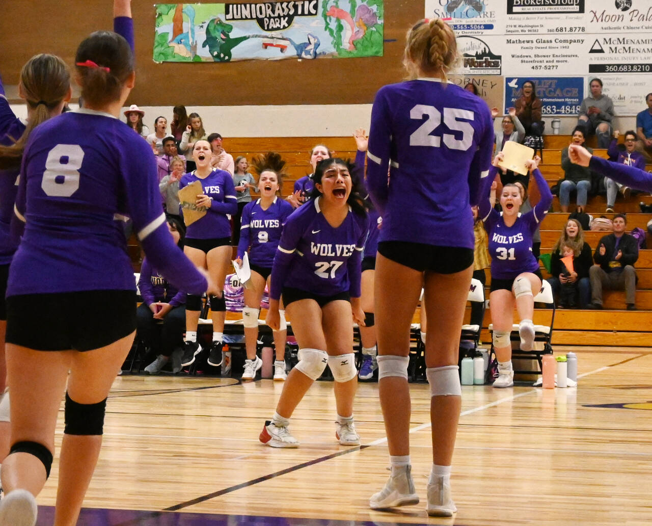 Sequim Gazette photos by Michael Dashiell
Sequim’s Kassi Montero, center, is fired up after the Wolves score a point in the come-from-behind fourth set win to knock off Kingston at home on Oct. 3.