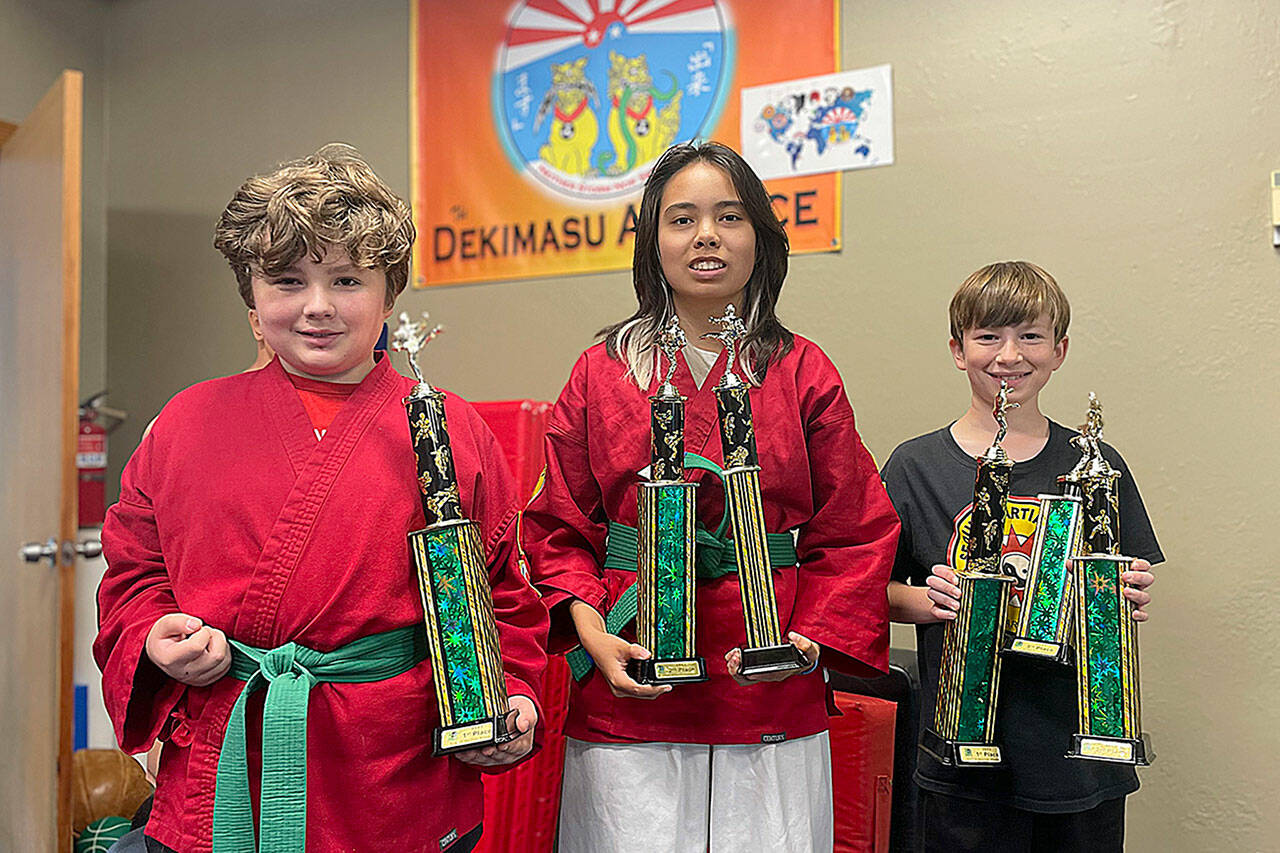 Sequim Gazette photo by Matthew Nash
Three students with Sequim Martial Arts, 235 E Washington St., Sequim, competed at the Tacoma City Classic Karate Tournament on Sept. 30. Local participants included, from left, Welcome Chapman, who won first place in “Traditional Weapons,” Khloe Schmidt who won second place both in “Traditional Weapons” and “Traditional Empty Hand Forms,” and Landen Parrish who won first place in “Traditional Empty Hand Forms,” second place in “Traditional Weapons” and third place in “Creative Weapons.”