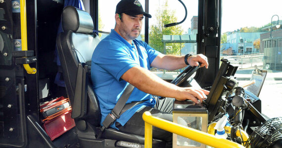 Clallam Transit driver Dante Ruiz prepares his bus for the 30 Route to Sequim on Wednesday at The Gateway transit center in Port Angeles. (Keith Thorpe/Peninsula Daily News)